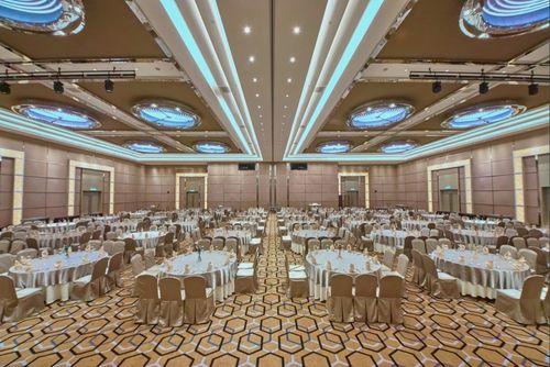 Sophisticated Ballroom With Striking Chandeliers and Geometric Flooring for Large Events
