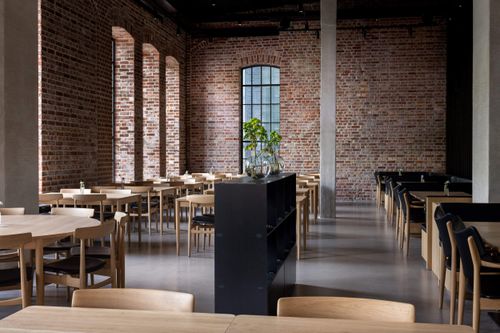 Industrial Brick-Walled Brasserie With Steel-Framed Windows for Dining