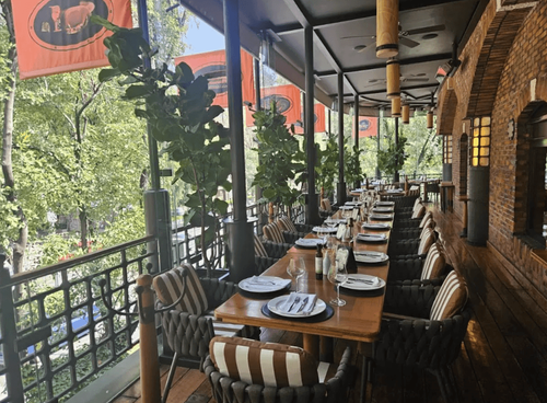 Leafy Terrace Restaurant With Brick Interiors for Dinners