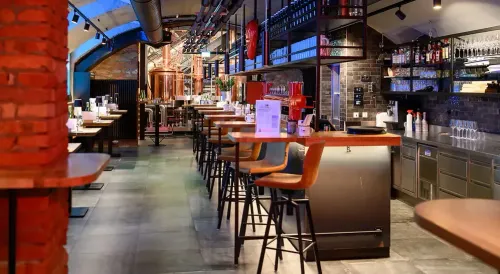 Brick-Vaulted Craft Brewery With Copper Kettles & Bold Graffiti for Beer Tastings and After-Work Socials
