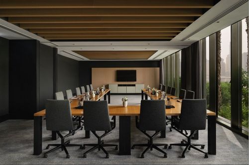 Sleek Timber-Lined Conference Suite With Garden Light for Corporate Briefings