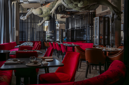 Dragon-Infused Dining Room With Deep Red Seating for Corporate Occasions