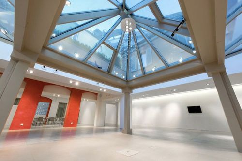 All-White Skylit Venue With Minimalist Design for Iconic Events