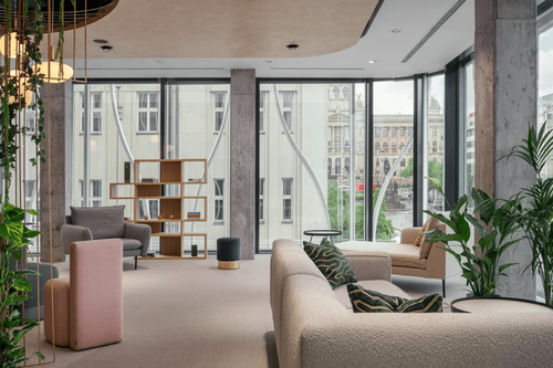 Urban Lounge With Floor-to-Ceiling Windows and Garden-Inspired Decor for Creative Events