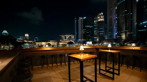 City-View Rooftop Bar With Indoor–Outdoor Seating for Business Mixers and Events