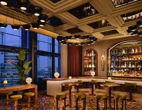 Art Deco Bar With Mirrored Coffered Ceilings and Skyline Views for High-End Corporate Receptions