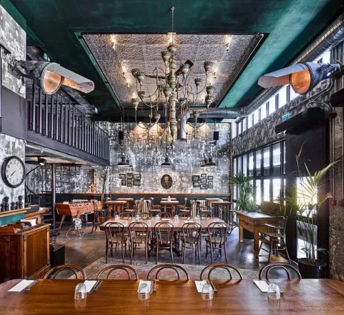 Dramatic Industrial Venue With Vintage Glam for Bold Corporate Gatherings