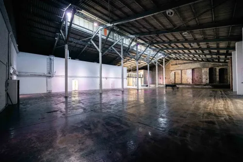 Former Railway Workshop With Steel Trusses and Yard for Exhibitions