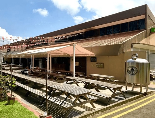 Rustic Brewery-Style Venue With Festive Charm for Outdoor Events and Gatherings