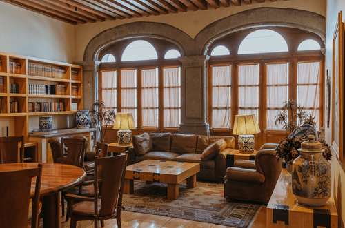 Stone-Arch Colonial Room With Timber Ceiling for Meetings