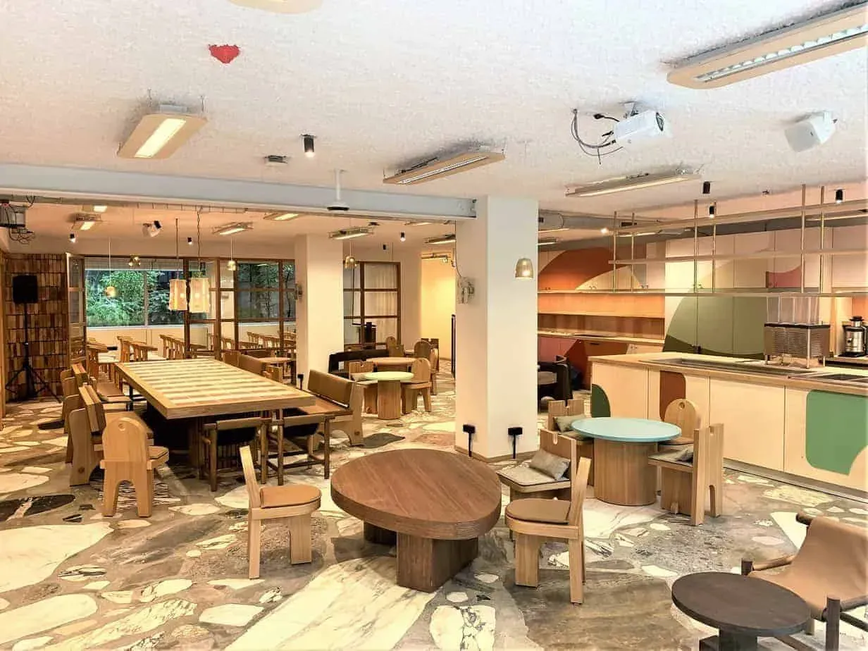 Cosy Co-Working Venue in Brussels With Ambient Lighting and Lush Greenery.webp