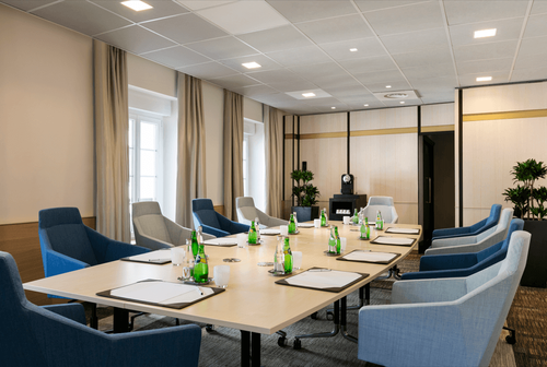 Boardroom With Natural Light and Blue Accents for Inspired Collaborations
