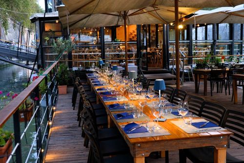 Floating Glass Restaurant With Wooden Details and Terrace for Mixers & Cocktail Events