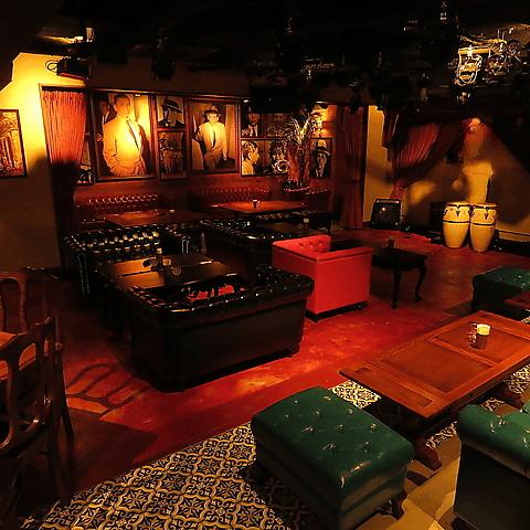 Intimate Red-Hued Cuban Lounge With Retro Velvet Charm for Exclusive Soirées