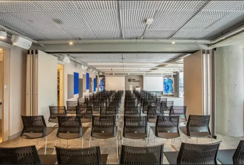 Bright Auditorium With Industrial Flair for Corporate Events