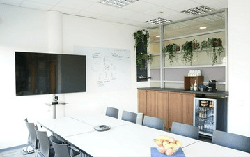 Bright Glass-Walled Room With Terrace Ideal for Strategic Meetings