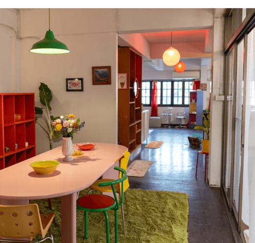 Mid-Century Modern Creative Flat With Vibrant Hues and Natural Light for Dynamic Team Sessions