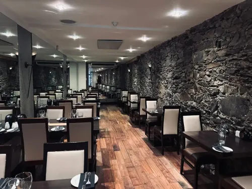 Intimate Dining Room With Exposed Stone Walls for Private Lunches and Client Dinners