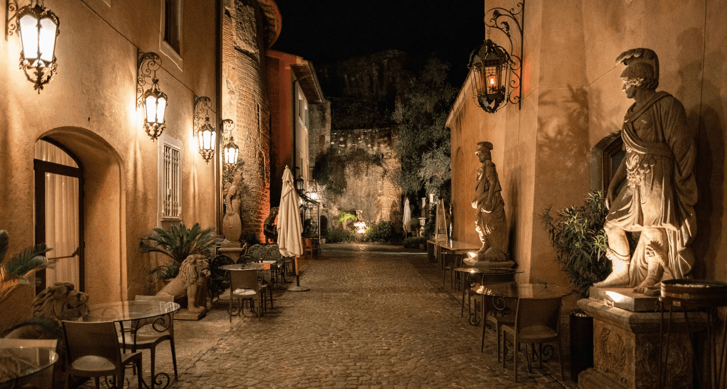 A Traditional Venue in Rome in a Historic Stone Alleyway With Sculptures.png