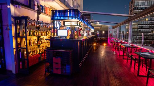Rooftop With Black Marble Bar and Skyline Views for After-Works