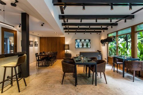 Modern Industrial Dining Room With Garden Views for Team Luncheons