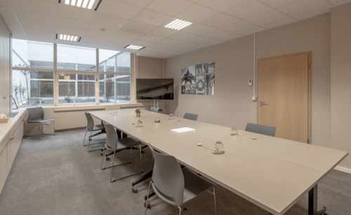 Streamlined Boardroom With Courtyard Views for Meetings