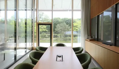 Scandinavian Meeting Room With Moss Tones and Terrace for Executive Meetings