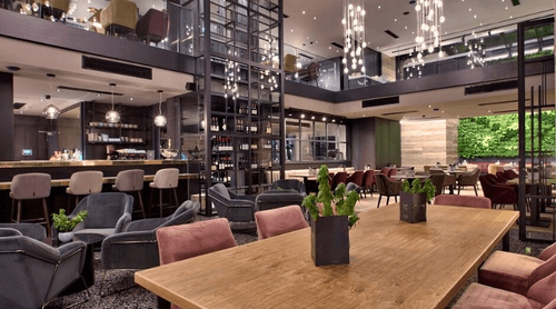 Industrial-Chic Restaurant With Verdant Living Wall and Glass Wine Vault for Elegant Private Events