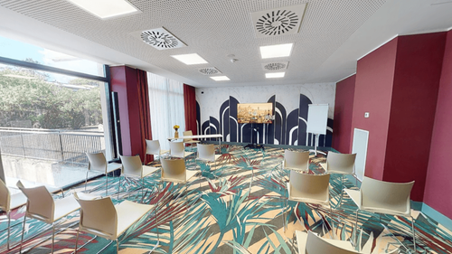 Fresh and Sleek Seminar Space Adorned With Rich Colours for Productive Gatherings