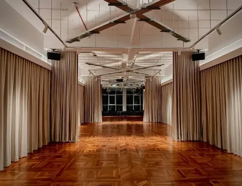 Minimalist Gallery With Herringbone Floors and Exposed Trusses for Art Shows and Brand Activations