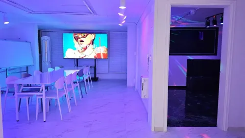 All-White Simple Studio With Lighting Ambience and Movie Area for Team Off-sites