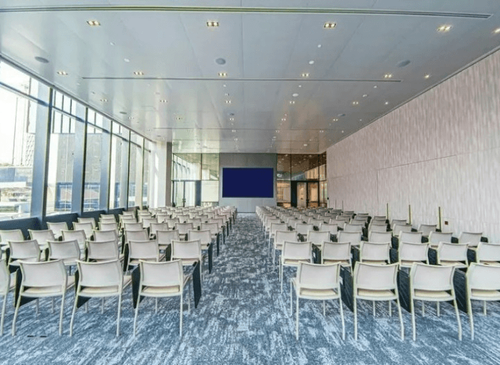 Modern Conference Room With Floor-to-Ceiling Windows and City View for Networking and Presentations