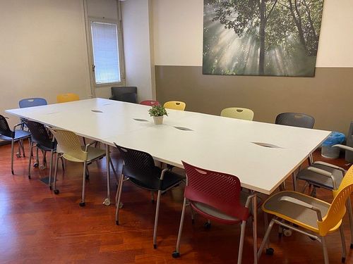 Engaging Meeting Room With Colourful Chairs for Dynamic Gatherings