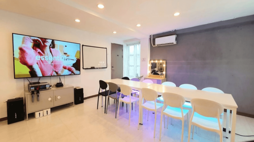 Monochrome Urban Room With LED Ambience and Karaoke Lounge for Interactive Meetings