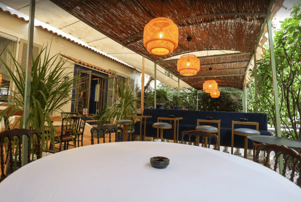 A trendy open-air small event venue with warm tones and a fresh atmosphere.png